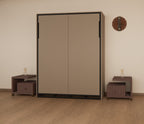 Brown wardrobe with two sliding doors in a room with a clock and small tables.