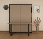 Beige wall-mounted cabinet with black frame in a room setting with a clock and vase.